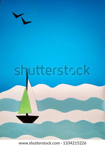 Paper application of a sailboat on the sea and seagulls