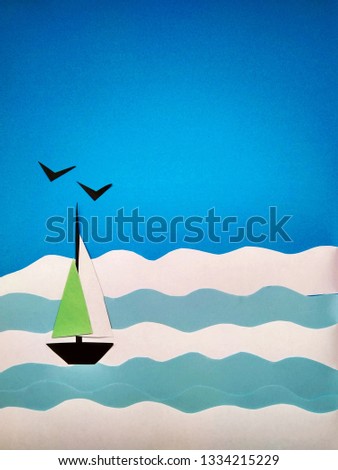 Paper application of a sailboat on the sea and seagulls