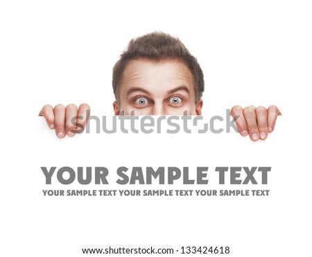 surprised young man holding white empty paper isolated on white background