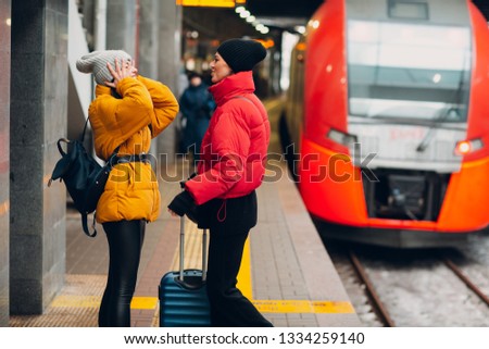 Young female and railway train.