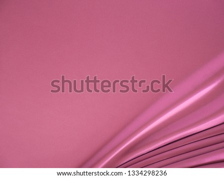 Smooth elegant wavy rose pink satin silk luxury cloth fabric texture, abstract background design. 