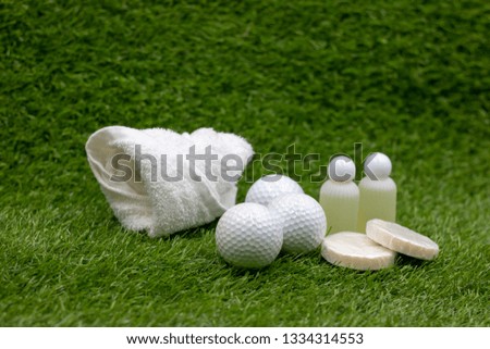 Golf ball in spa with shampoo and soap