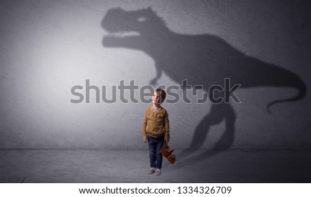 I m dreaming about dinosaurus concept with cute little boy in an empty room