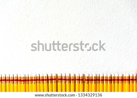 Yellow pencil in line background on with background