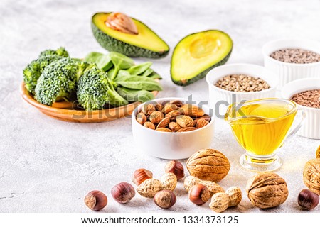 Vegan sources of omega 3 and unsaturated fats. Concept of healthy food. Royalty-Free Stock Photo #1334373125