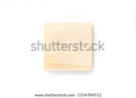 Wooden square on white background. Lumber piece close-up, top view, isolated.