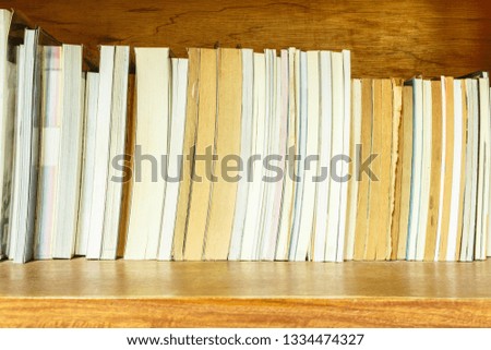 book stack on shelf in Library.