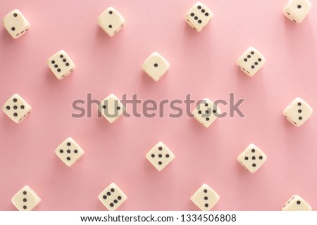 White gaming dices on pink background. victory chance, lucky. Flat lay, place for text. Top view. Close-up. Concept gamble. Royalty-Free Stock Photo #1334506808
