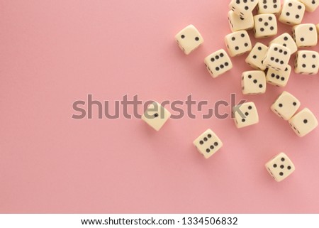 White gaming dices on pink background. victory chance, lucky. Flat lay, place for text. Top view. Close-up. Concept gamble. Royalty-Free Stock Photo #1334506832