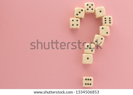 White gaming dices on pink background, question mark. victory chance, lucky. Flat lay, place for text. Top view. Close-up. Concept gamble.