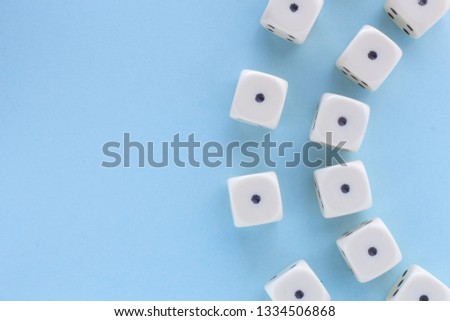 White gaming dices on light blue background, sun. victory chance, lucky. Flat lay, place for text. Top view. Close-up. Concept gamble.