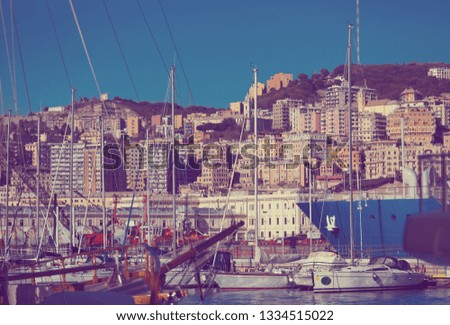 Image of  old port of Genova city with boats at quay, Italy