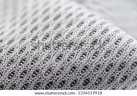 Grey and white knitting fabric texture marco 