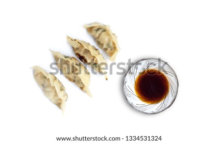 Picture of  dumplings or gyoza with soy sauce isolated on white background