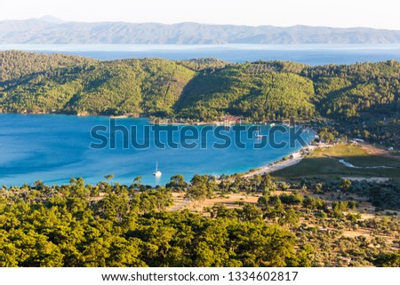 An aerial view of Akbük Bay, Akyaka Muğla in Turkey during summer. Royalty-Free Stock Photo #1334602817
