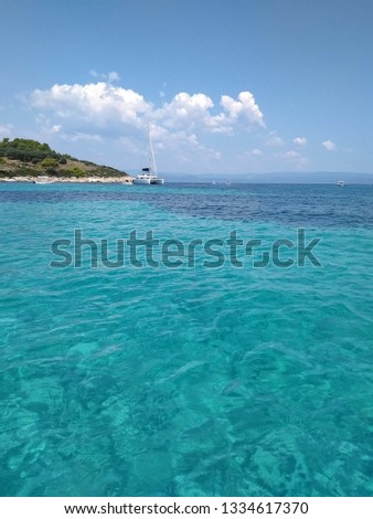 Blue water seascape in Diaporos, Chalkidiki. Aegean Sea, Greece. 