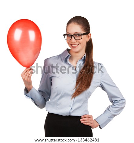 Young business woman in glasses with a red balloon inflated