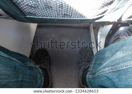 One of the major issues with being tall and air travel.....legroom. Royalty-Free Stock Photo #1334628653