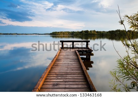 wooden pier on big lake in Groningen Royalty-Free Stock Photo #133463168