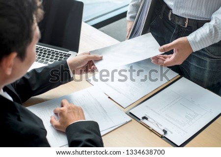 Businessman sending a resignation letter to employer boss in order to resign dismiss contract, changing and resigning from work concept.