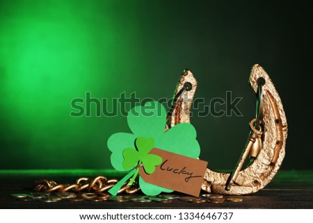 St.Patrick's Day. Golden horseshoe with clover leafs and coins