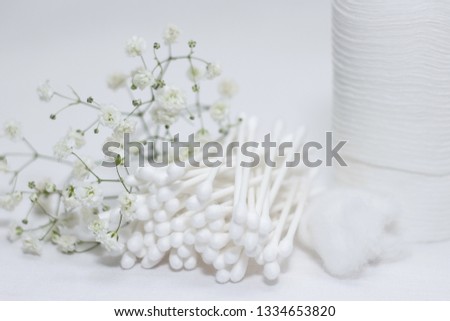 Pile of cotton hygienic sticks, cotton pad on white background