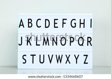 Lightbox with letters on grey background