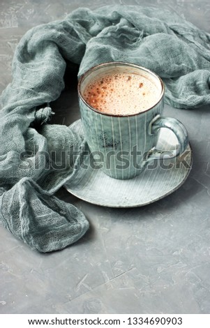 Cocoa drink in  ceramic  mug on stone  background