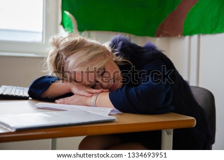 A teacher who slept with exhaustion after long test fixes.