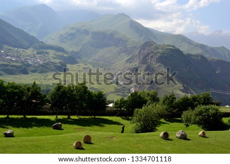 landscape Caucasian mountains in summer. Mountain range clouds panoramic landscape - Image