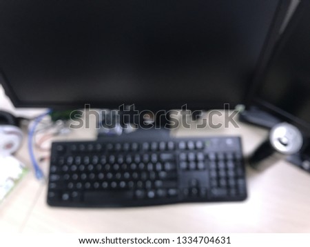 Royalty high quality free stock photo of abstract blur and defocused of the computer set in modern office/ technology company: LCD screen, keyboard, mouse, headset, cable, energy drink cans