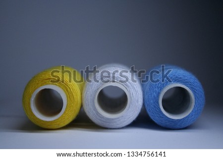colored spools of thread