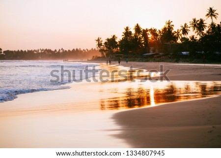 Beautiful beach and Indian ocean in Sri Lanka on sunset.