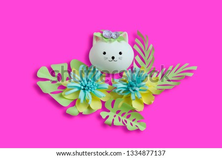 Handmade cute cat made of egg and paper flower decorations. Creative Easter decor, kawaii style. Minimal easter concept