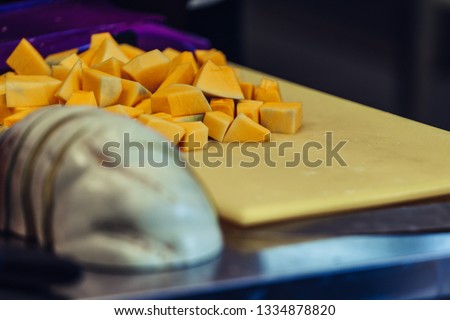 Cut Pumpkin Pieces on the Yellow Plastic Board - Kitchen Set, Vintage Film Look