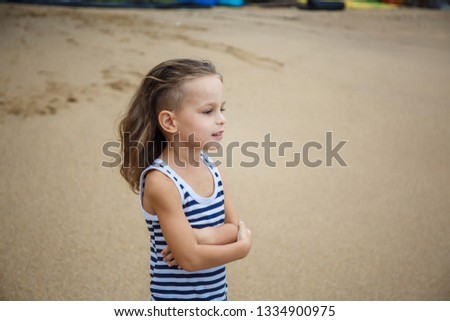 Little five years old boy is watching on the sea in Thailand 