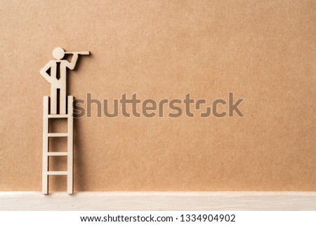 Business and design concept - group of wooden businessman icon with stairs on kraft paper. it's conversation, leadership and teamwork concept