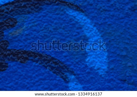 Closeup abstract paint designs on rough texture background.