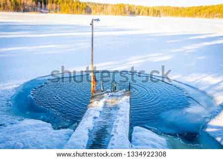 Pool at the frozen lake in Finland
