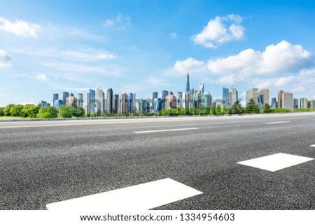 Shanghai city skyline and famous landmark buildings with empty asphalt road