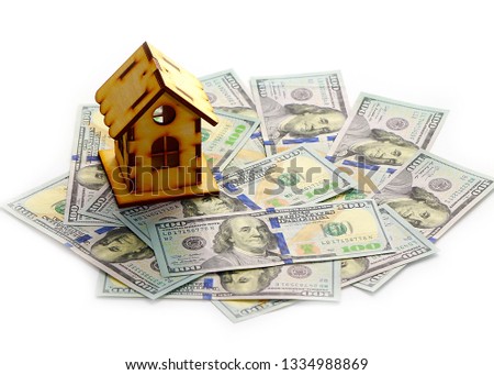 wooden house stands on a pile of paper bills dollars as a symbol of mortgage