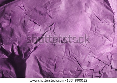Recycled wrapping paper. Violet tones.