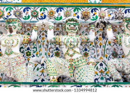 Giant spinning image decorated on the wall of Wat Arun Ratchawararam Ratchaworawihan.