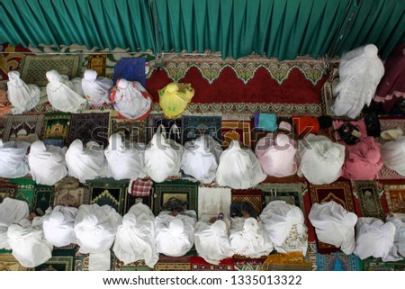 Muslim prayer congregation in the mosque Royalty-Free Stock Photo #1335013322