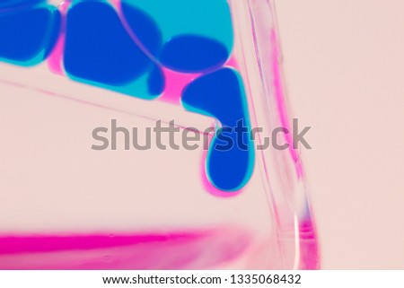 Macro picture of multi-colored lava bubblier with dark blue and pink lave droplets forming