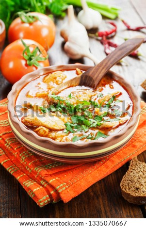 Traditional Georgian soup kharcho in a plate on the table