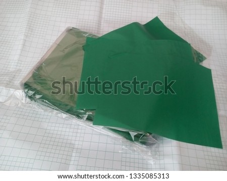 plastic cover for books, on striped paper