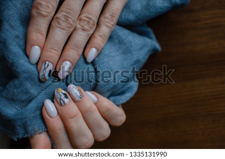 Female hands with beautiful nail polish. Nail art manicure. flower nails concept