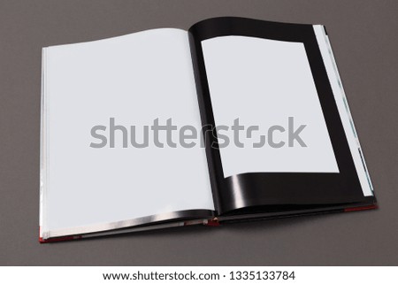 Mock-up magazine or catalog on gray background.Blank page or notepad for mockups or simulations. 