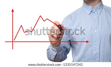 Young businessman holding marker and writes on glass screen for adding text and graphic.